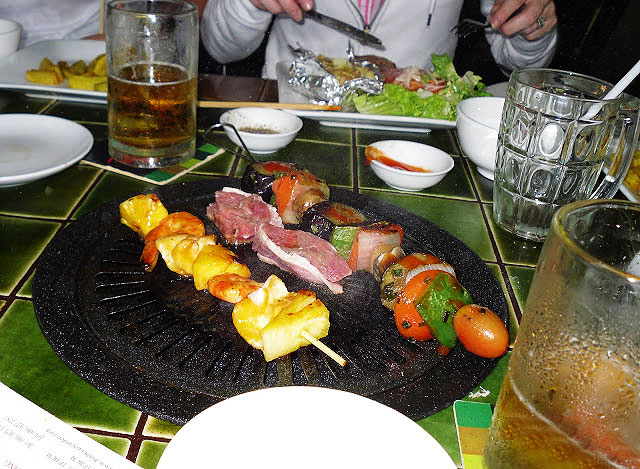 Eating BBQ on a rainy day in Saigon