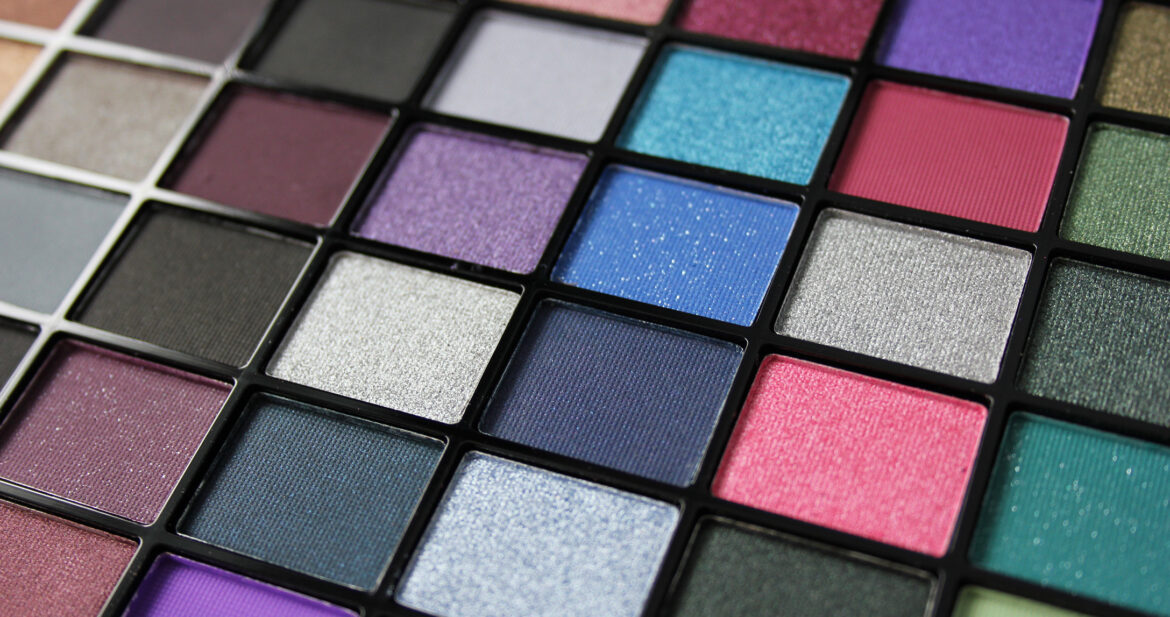 Closeup of multi coloured eyeshadows in a palette