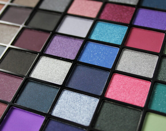 Closeup of multi coloured eyeshadows in a palette
