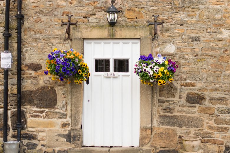 White door with a sign on the front which says "Bar"
