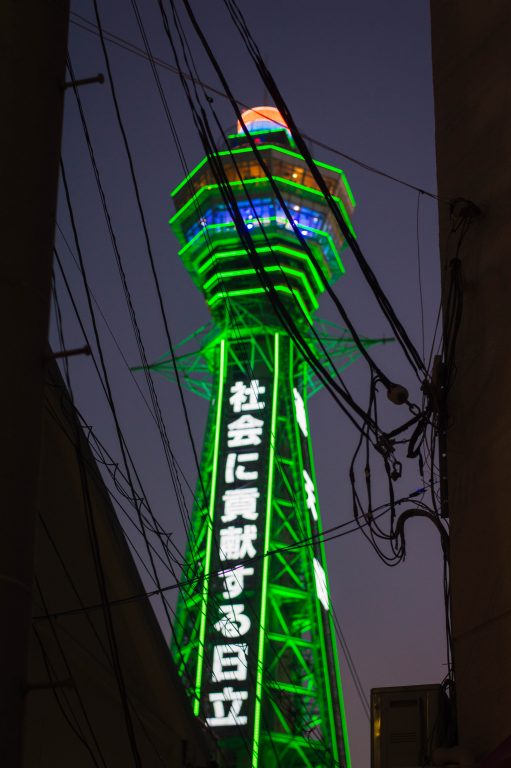 Tsutenkaku Tower lit up in green