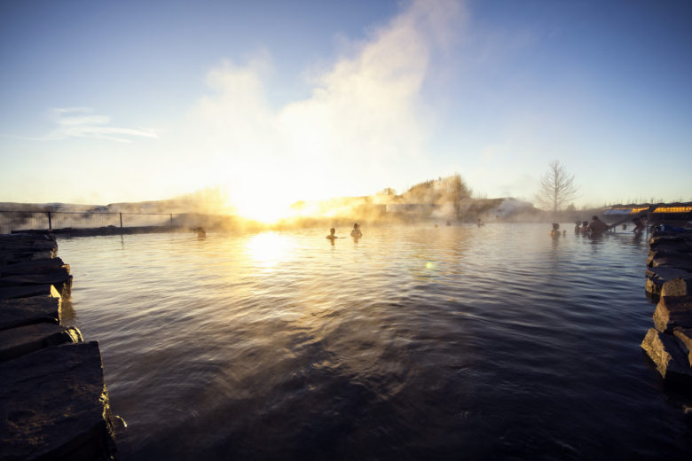 Mist rising over the water at The Secret Lagoon Iceland