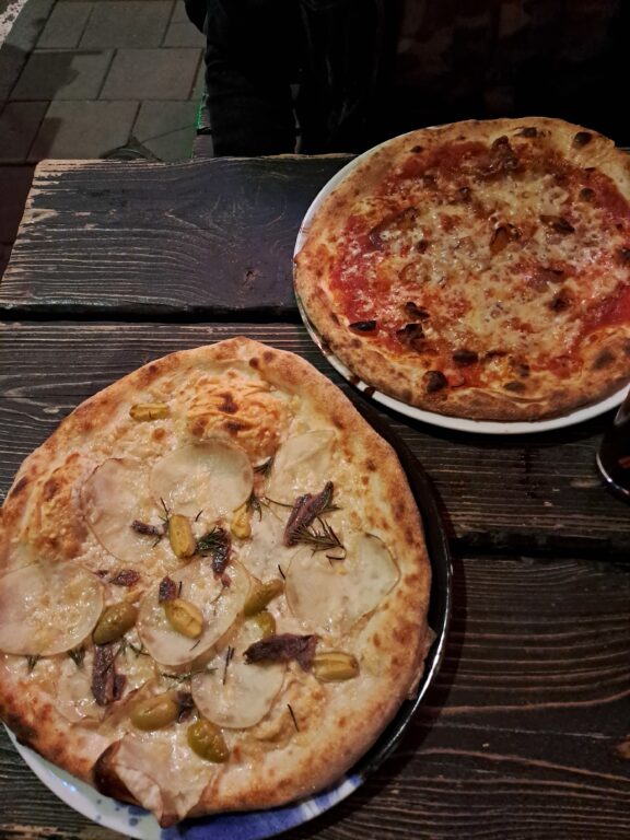 stockholm pizza - Photo of two pizzas with different toppings