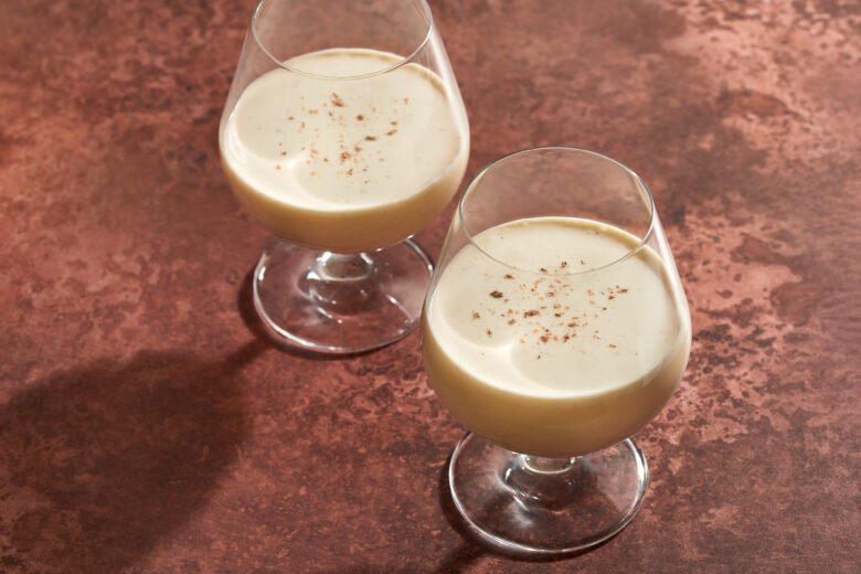 Photo of two brandy glasses filled with eggnog - Homemade Eggnog Recipe