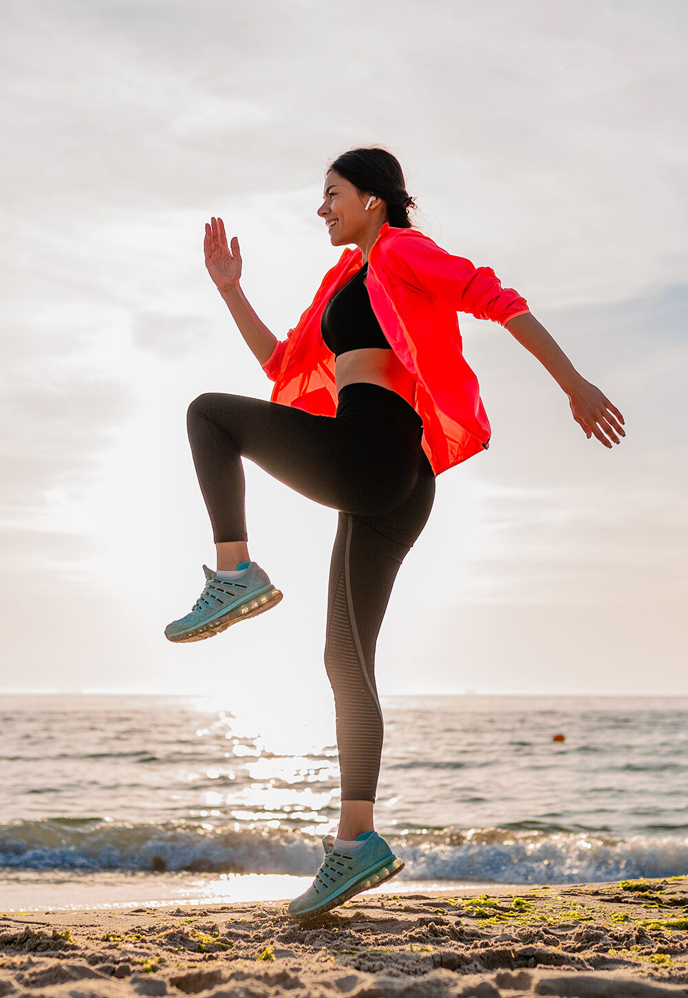 Woman working out on a beach