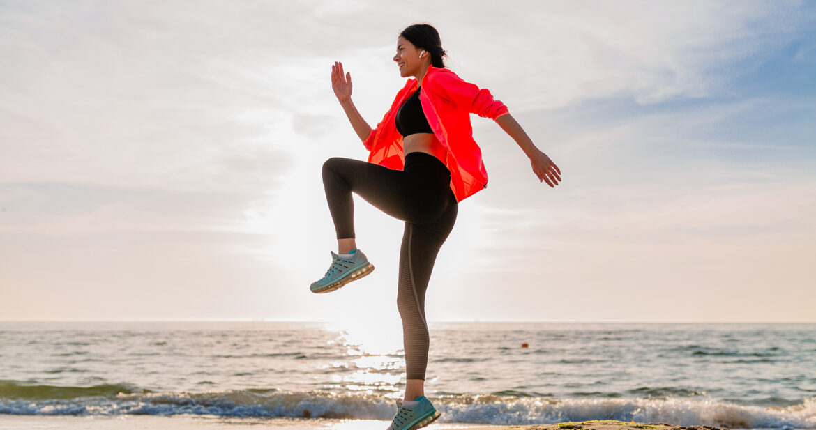 Woman working out on a beach