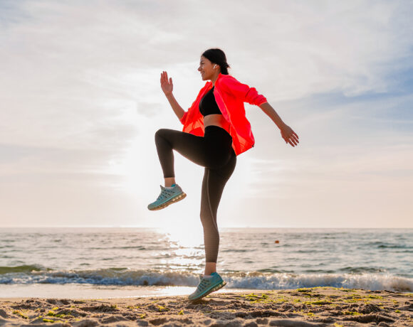 Woman working out on a beach