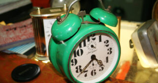 green vintage alarm clock