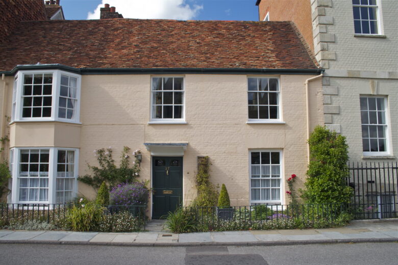 pink house with flowers in front