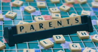 scrabble board that says Parents
