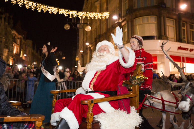 Father Christmas waving to the crown at the Birmingham Christmas market parade