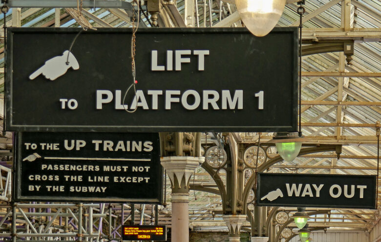 Directional signs at Hebden Bridge Station in England. 