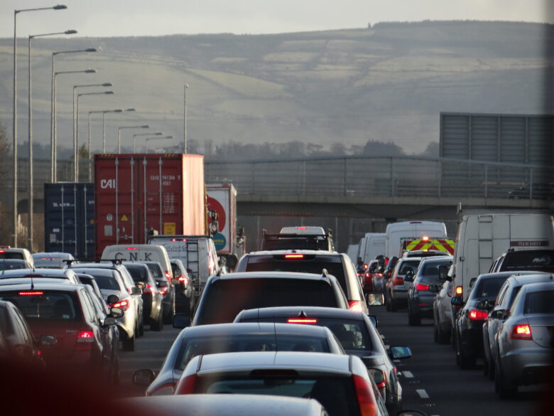 cars in traffic with brake lights pressed