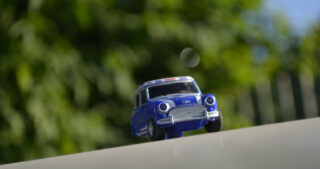 Toy Mini Cooper on the road