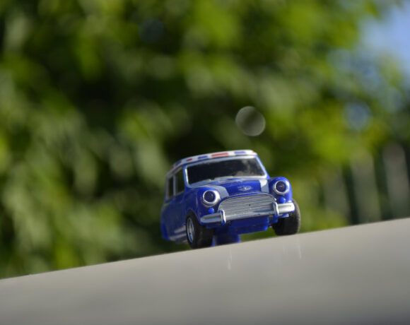 Toy Mini Cooper on the road