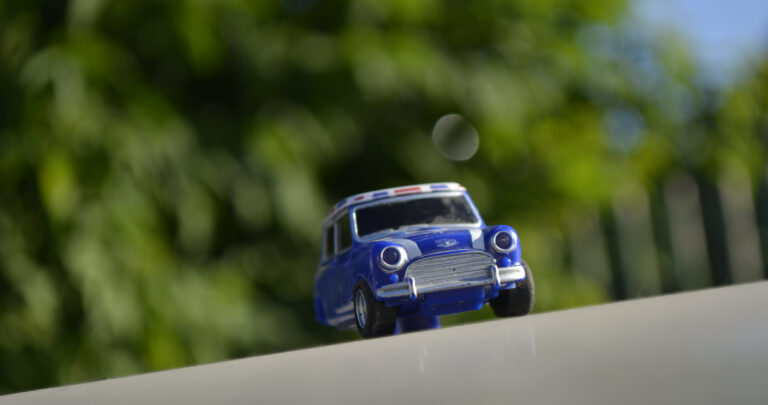 Toy Mini Cooper on the road