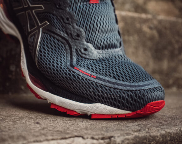 grey running shoe on a strap.