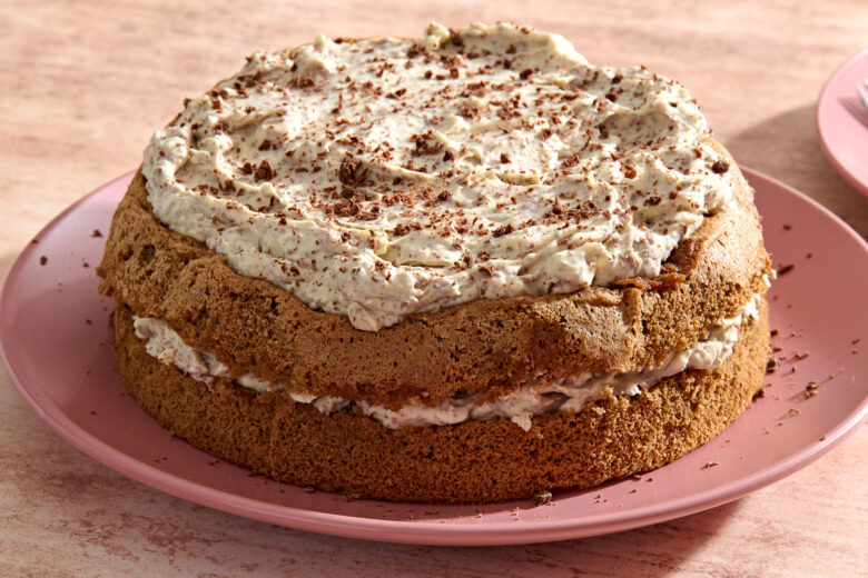 Tiramisu Cake on a plate sprinkled with chocolate