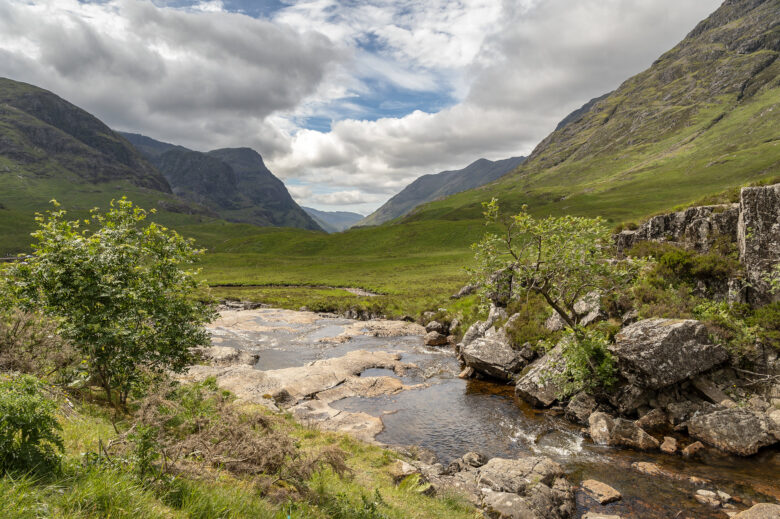 Stream and green hills in Glencoe, Scotland