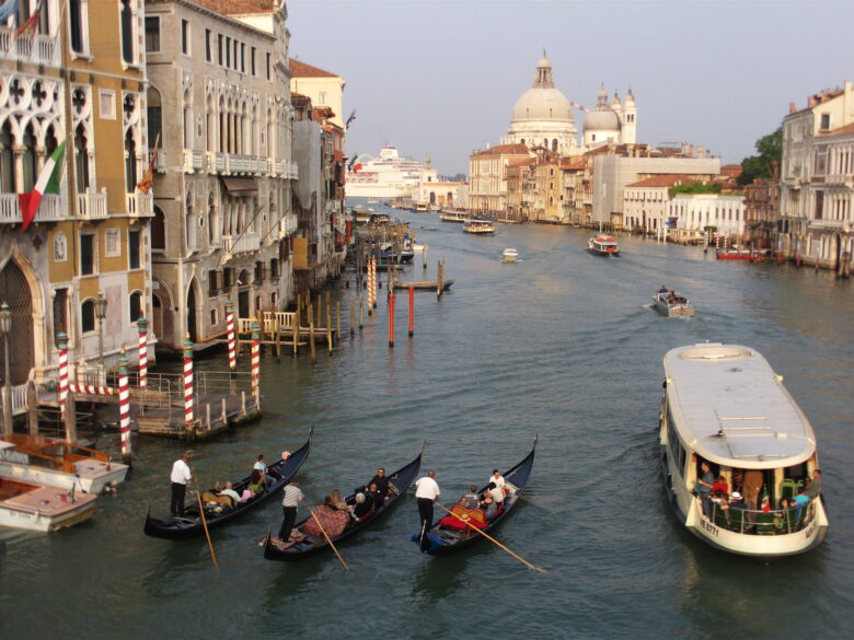 Venice canal with gondolas and boats