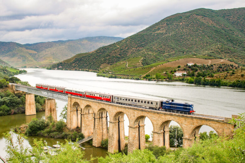 Train driving over a bridge in the miradouros of Lisbon