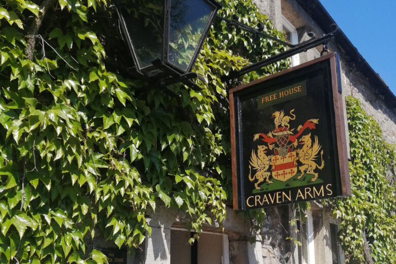 Sign hanging outside the Craven Arms pub in Appletreewick - pubs that play the Drovers Arms in All Creatures Great and Small