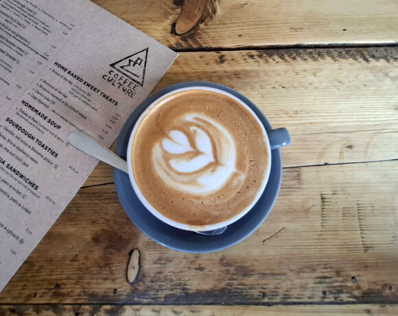 Overhead view of a coffee on a wooden table at Coffee Culture in York