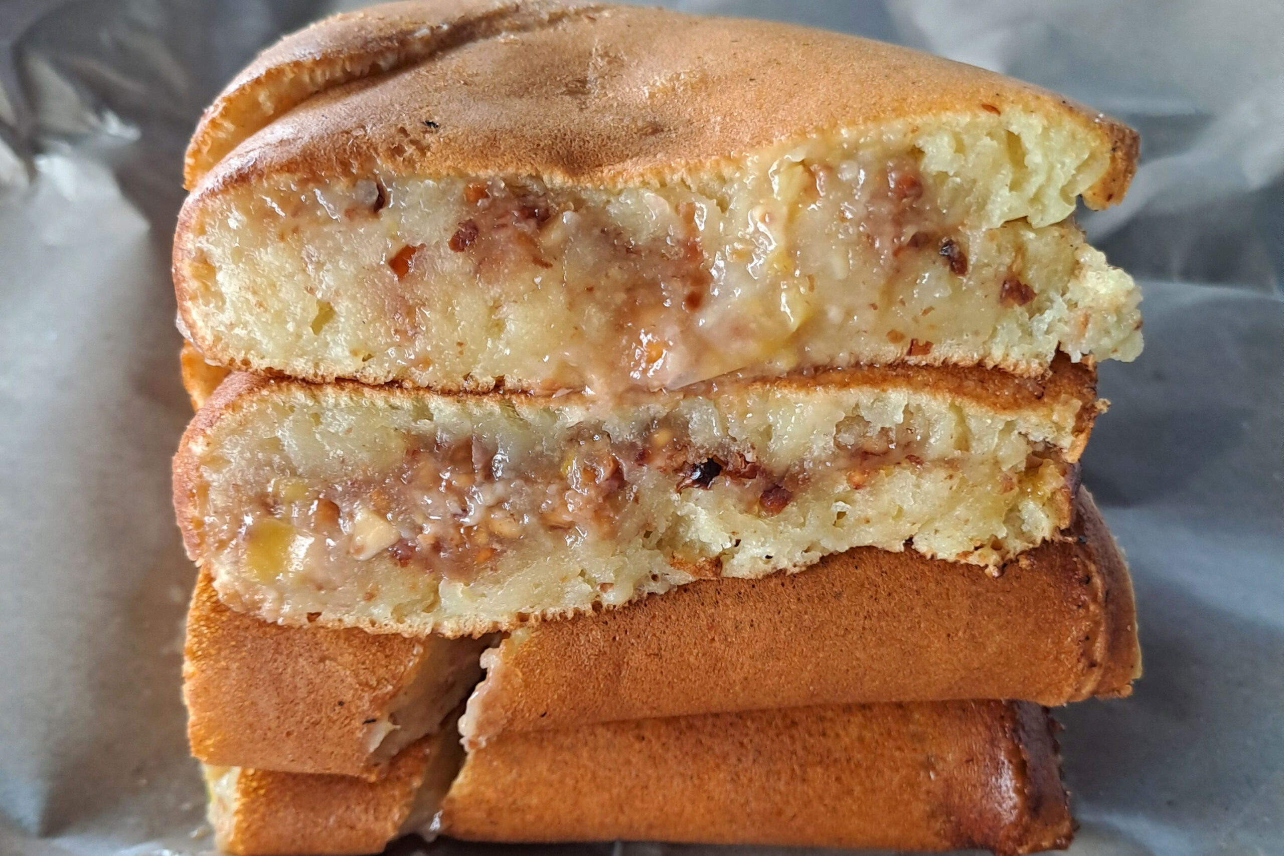 A stack of apam balik pancakes bought from a street vendor in Melaka, Malaysia