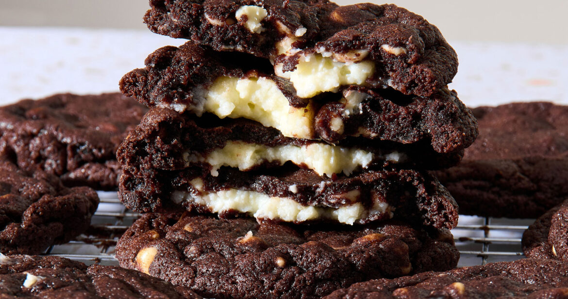 Closeup shot of a stack of double chocolate cheesecake cookies broken in half